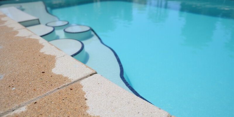 Stained pool surface showing discoloration patterns